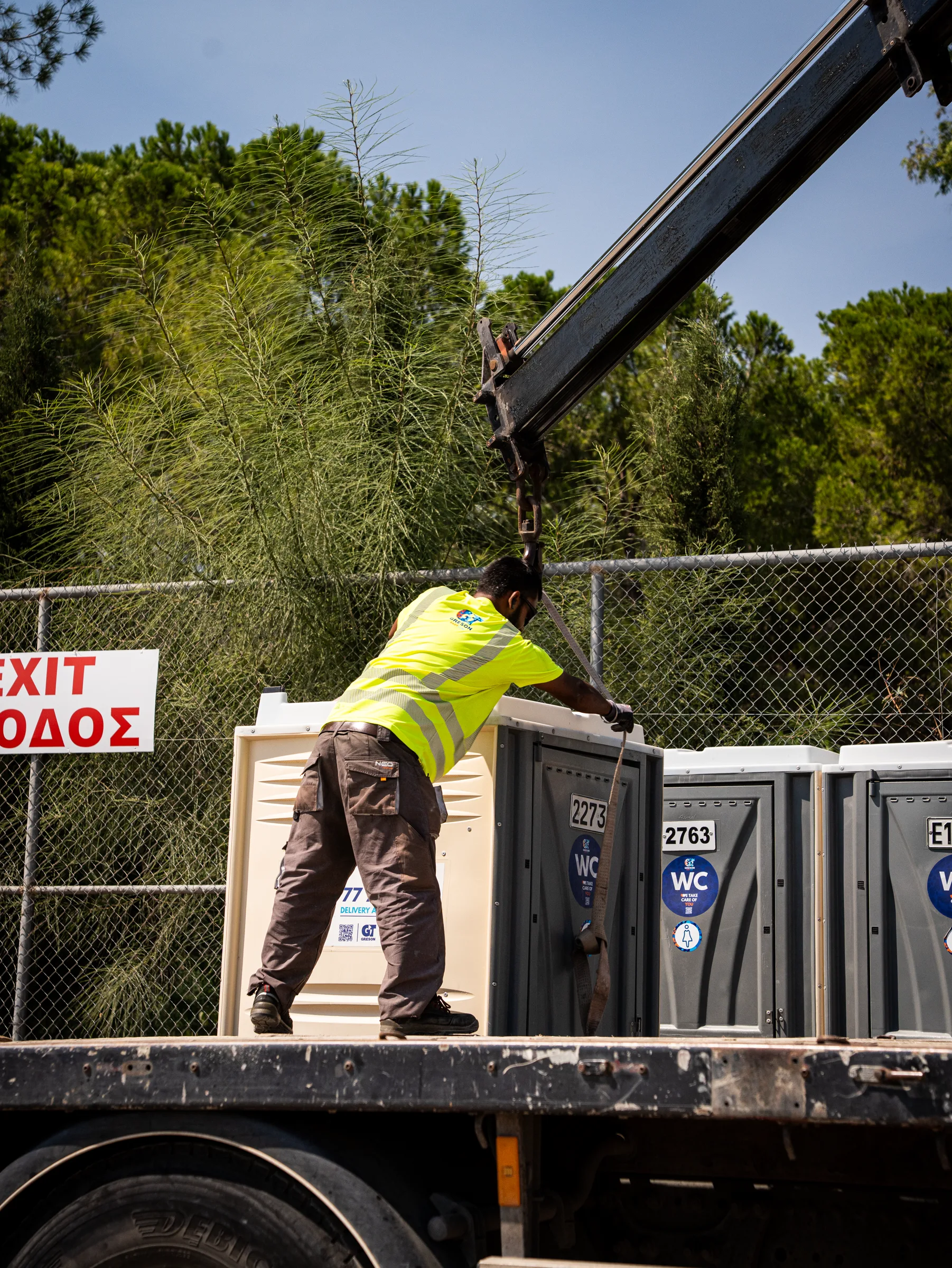 Greson Easy Loo crew loading portable toilets onto a lorry